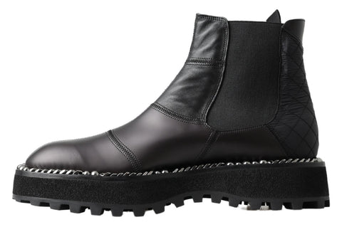 Black leather slip-on stretch boots by Dolce & Gabbana, featuring a sleek design and comfortable fit.