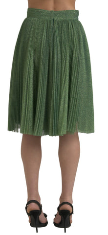 Metallic green high waist A-line pleated skirt by Dolce & Gabbana, shown on a model with flowing fabric and stylish design.