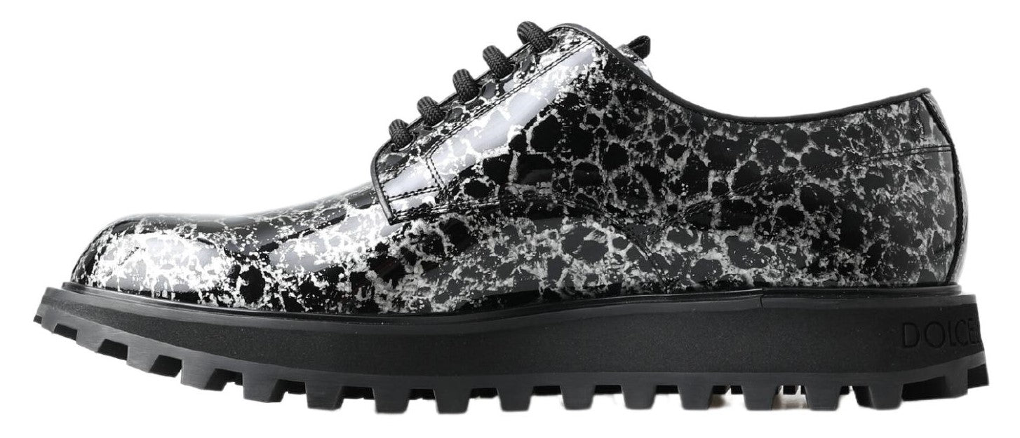 Black and white Dolce & Gabbana derby shoes in patent leather with classic design and sleek finish.