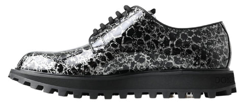 Black and white Dolce & Gabbana derby shoes in patent leather with classic design and sleek finish.