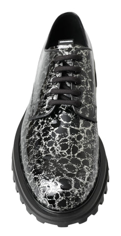 Black and white patent leather derby shoes by Dolce & Gabbana, with sleek design and polished finish.