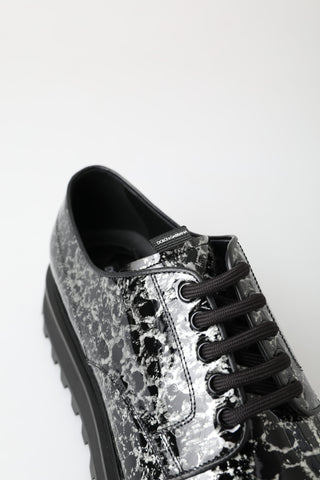 Black and white Derby patent leather shoes by Dolce & Gabbana with sleek design and polished finish.
