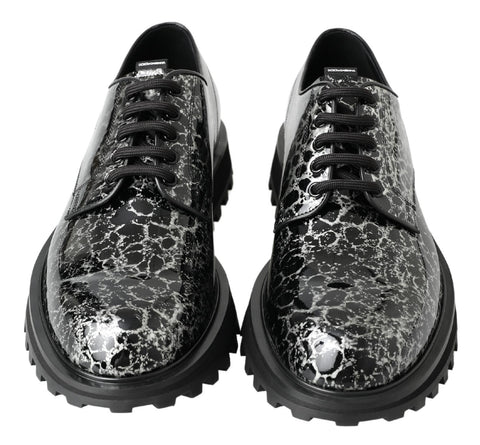 Black and white patent leather derby shoes by Dolce & Gabbana, featuring classic design and polished finish.
