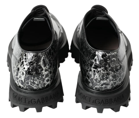 Black and white patent leather derby shoes by Dolce & Gabbana, featuring a classic design and sleek finish.