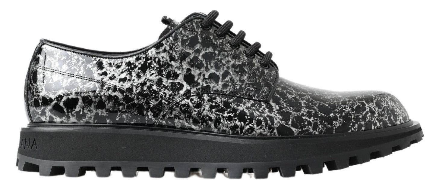 Black and white patent leather derby shoes by Dolce & Gabbana, featuring a sleek and polished design for formal wear.