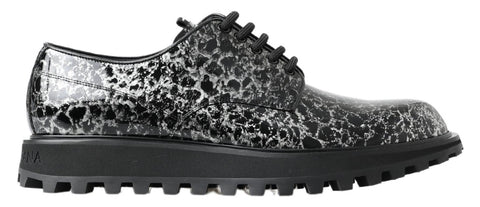 Black and white patent leather derby shoes by Dolce & Gabbana, featuring a sleek and polished design for formal wear.