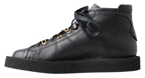 Black leather slip-on stretch boots by Dolce & Gabbana, featuring sleek design and comfortable fit.