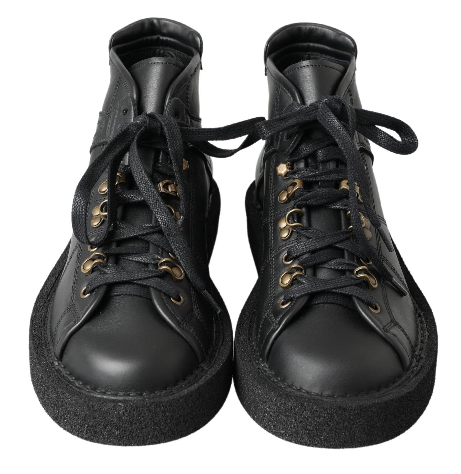 Black leather slip-on stretch boots by Dolce & Gabbana, showing sleek design and smooth texture.