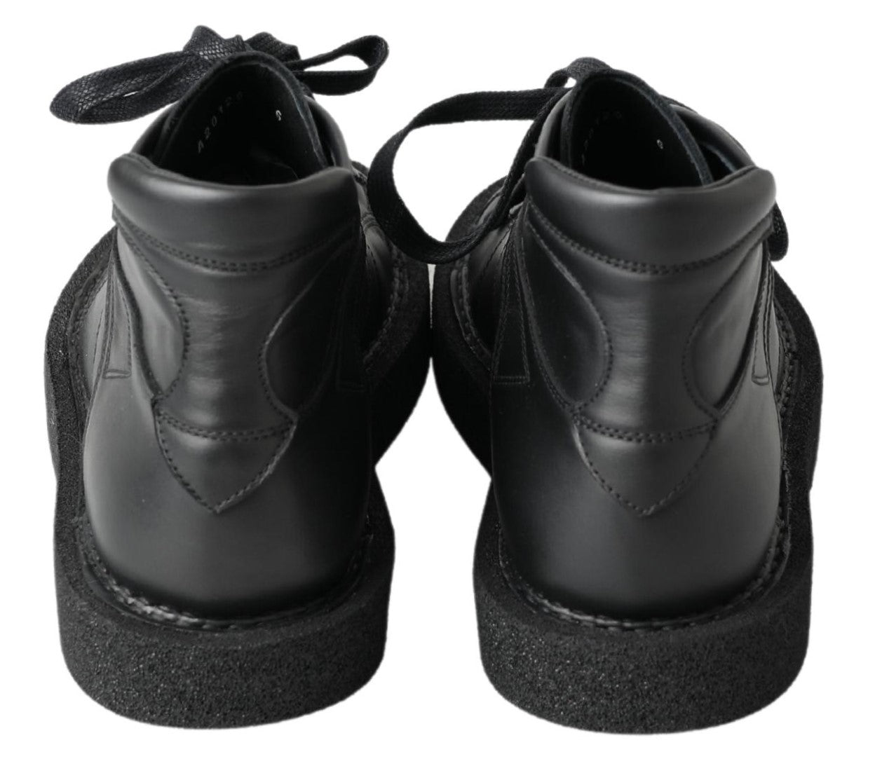 Black leather slip-on stretch boots by Dolce & Gabbana, featuring sleek design and comfortable fit.
