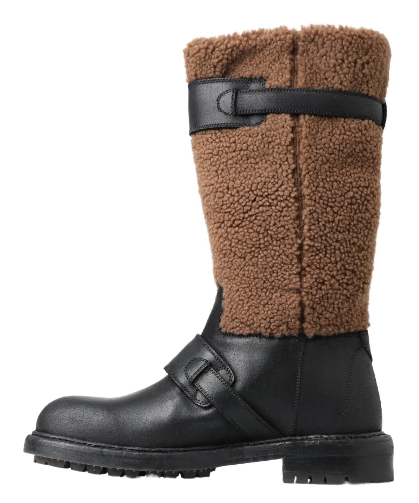 Black leather and brown shearling boots by Dolce & Gabbana with lace-up design and rugged sole, stylish winter footwear.