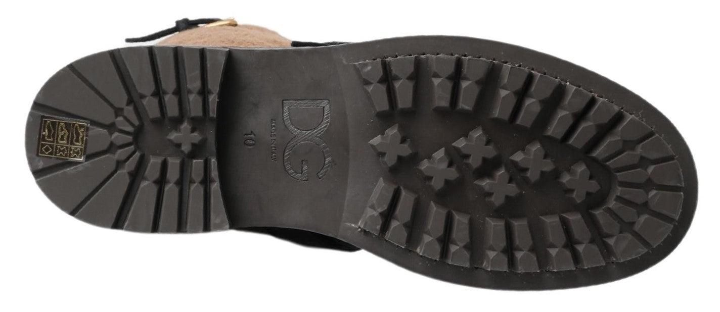 Black leather and brown shearling boots by Dolce & Gabbana, featuring a stylish ankle design with laces and textured sole.