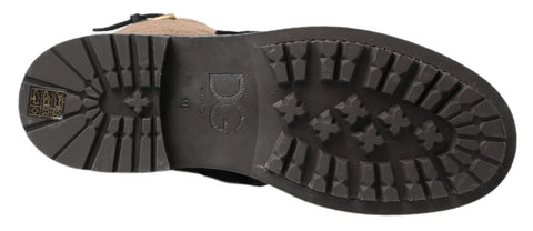 Black leather and brown shearling boots by Dolce & Gabbana, featuring a stylish ankle design with laces and textured sole.