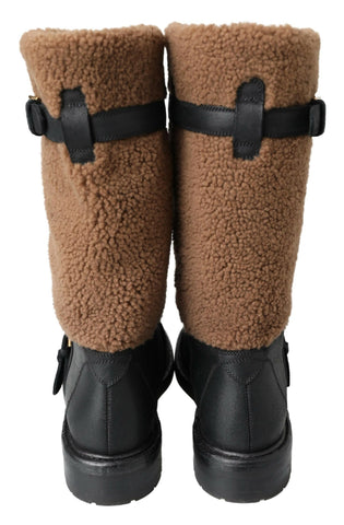 Black leather and brown shearling boots by Dolce & Gabbana, showcasing stylish ankle-high design and textured material details.