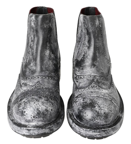 Black and gray leather ankle boots by Dolce & Gabbana featuring sleek design and stylish ankle-length silhouette.