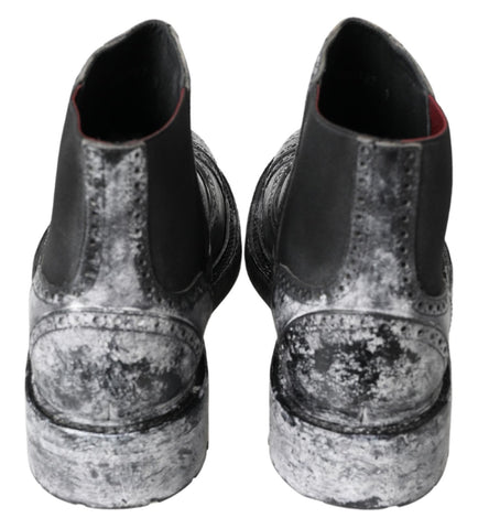 Black and gray leather ankle boots by Dolce & Gabbana featuring sleek design and stylish ankle-high silhouette.