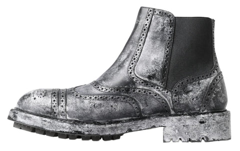 Black and gray leather ankle boots from Dolce & Gabbana with sleek design and pointed toes.