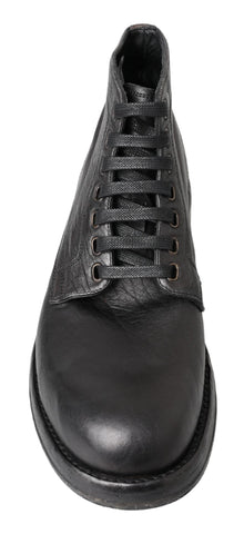 Black leather Perugino boots by Dolce & Gabbana featuring sleek design and sturdy soles.