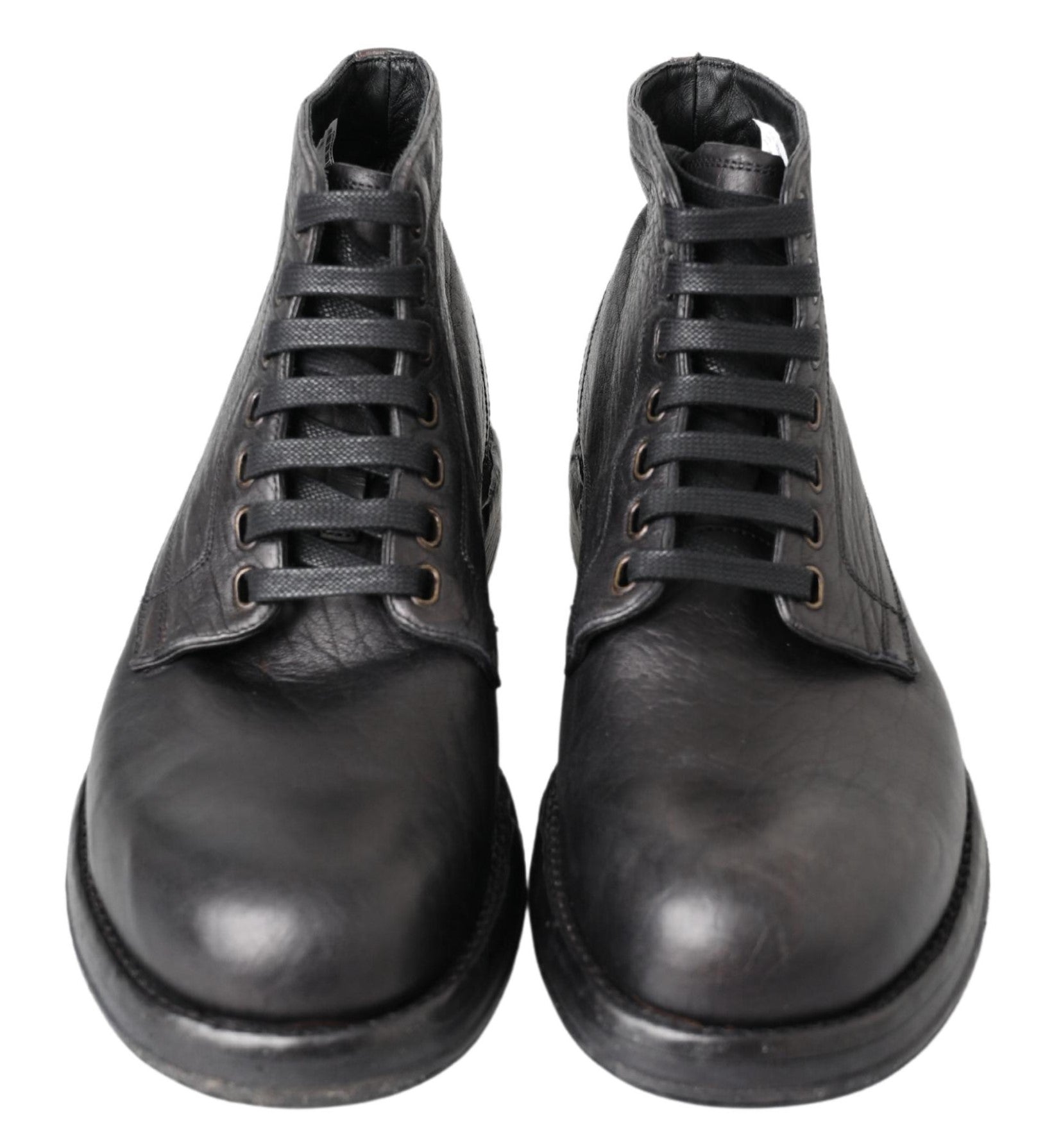 Black leather Perugino boots by Dolce & Gabbana featuring sleek design and classic horsebit details.