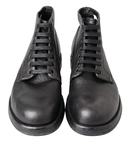 Black leather Perugino boots by Dolce & Gabbana featuring sleek design and classic horsebit details.