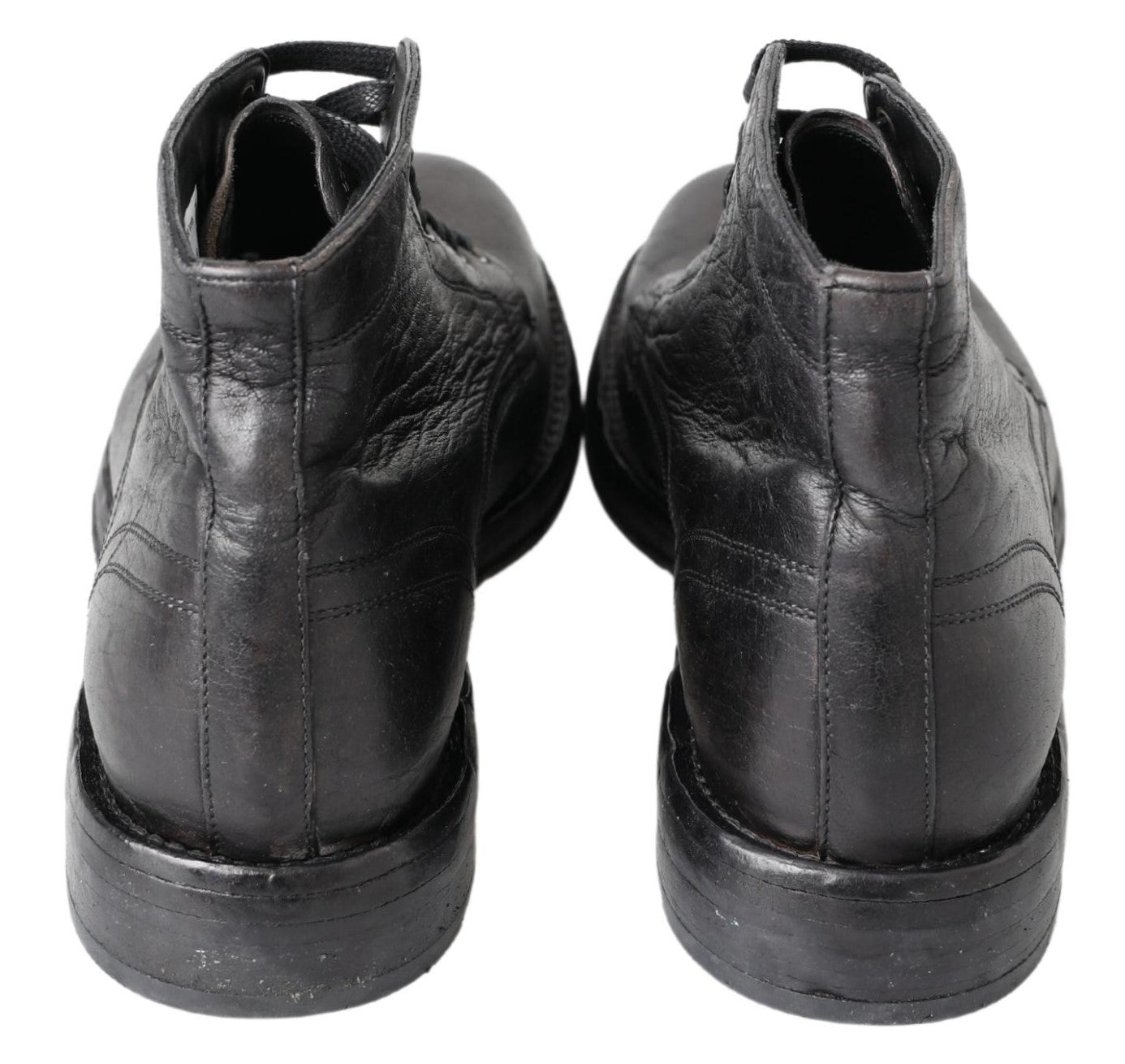 Black leather Perugino boots by Dolce & Gabbana featuring sleek design and ankle-high style.