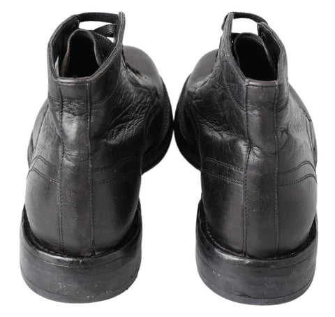 Black leather Perugino boots by Dolce & Gabbana featuring sleek design and ankle-high style.