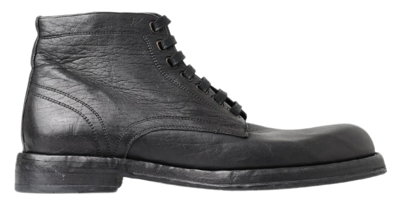 Black Leather Perugino Boots by Dolce & Gabbana, featuring sleek design and classic style, shown from the side view.