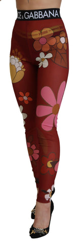 Red floral Dolce & Gabbana leggings with stretchy waist and fitted design, featuring vibrant flower patterns.