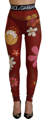 Red floral Dolce & Gabbana leggings with stretchy waist and vibrant floral pattern, close-up of the stylish pants.