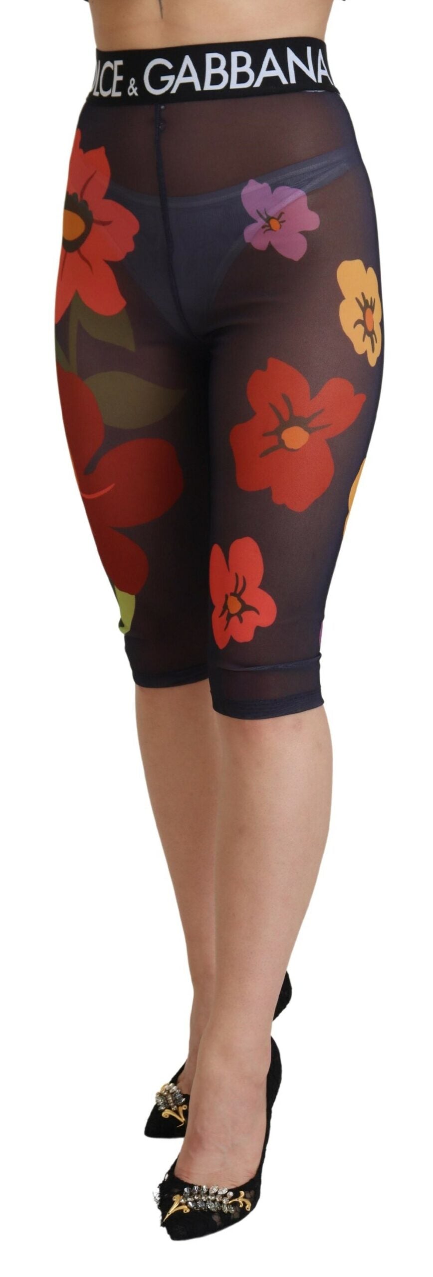 Black floral Dolce & Gabbana leggings with stretch waist and fitted design, featuring a vibrant floral pattern.