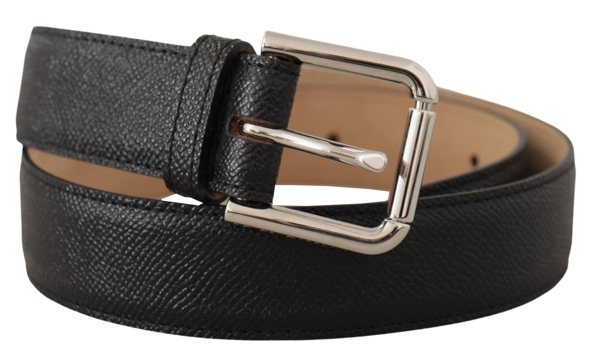 Black calf leather belt with brown back end and metal buckle by Dolce & Gabbana, featuring sleek design and adjustable fit.