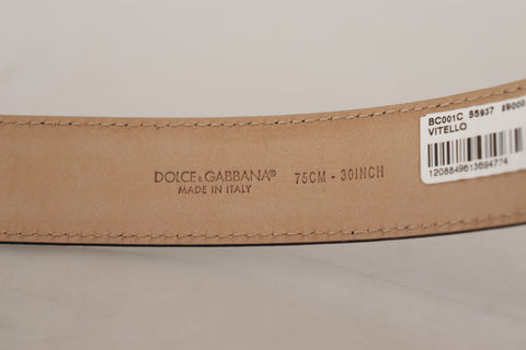Black calf leather belt with brown backend and metal buckle from Dolce & Gabbana, showing the detailed strap and buckle design.