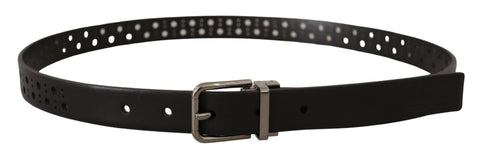 Black calf leather belt with perforated design and metal buckle by Dolce & Gabbana, shown with close-up of textured strap and buckle.