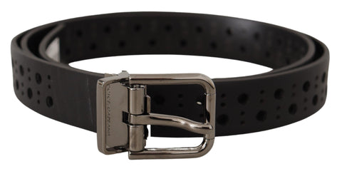 Black calf leather belt with perforations and a metal buckle, stylish Dolce & Gabbana accessory on a white background.