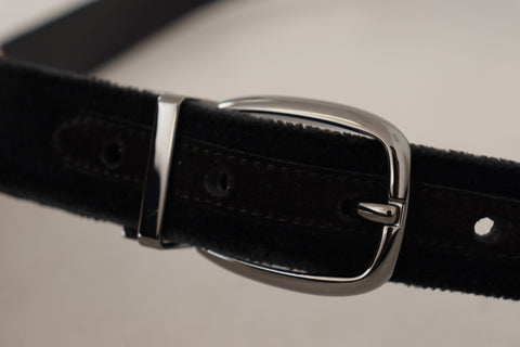 Black velvet Dolce & Gabbana belt with engraved metal logo, featuring a classic design and silver-tone buckle.