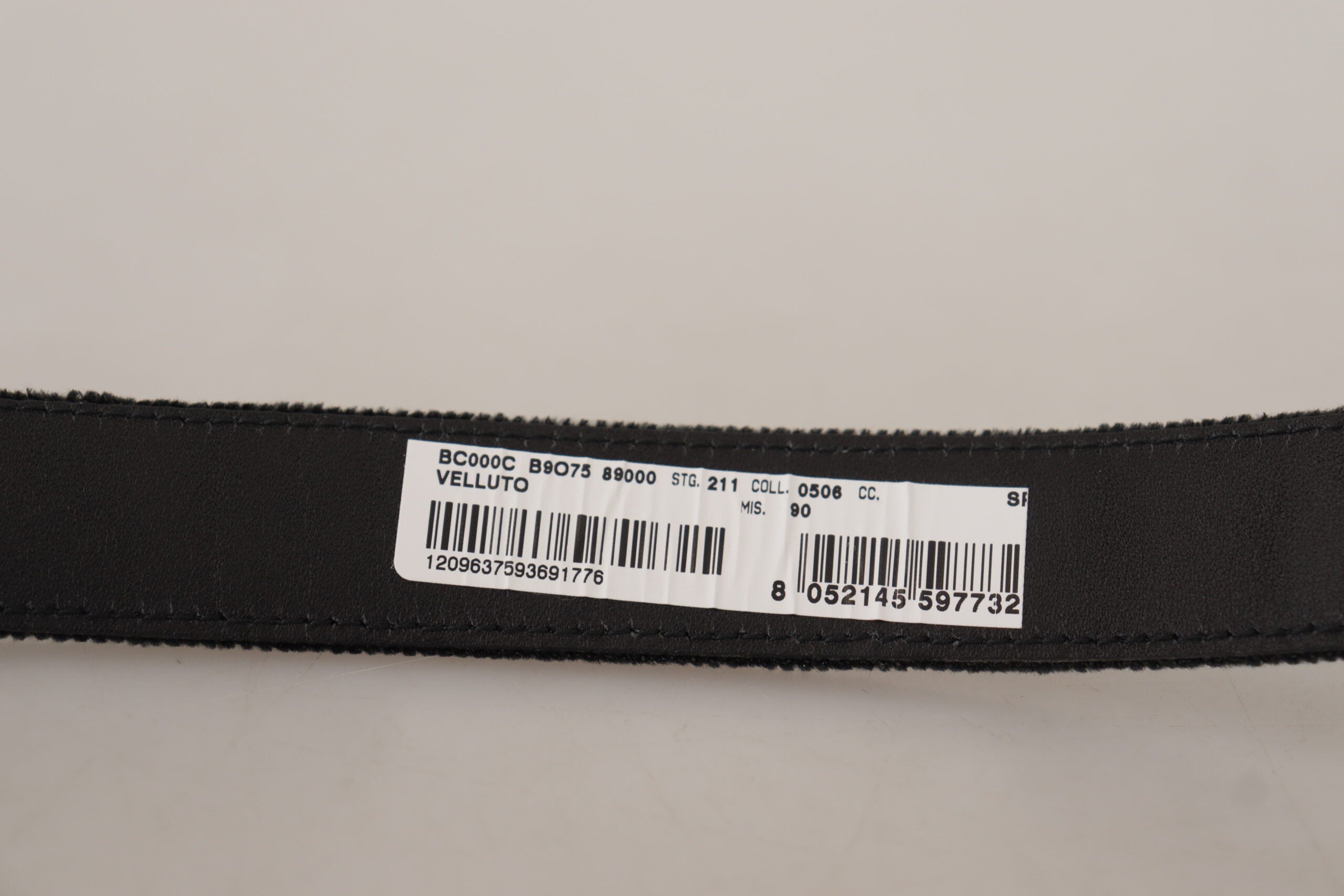 Black velvet Dolce & Gabbana belt with engraved metal logo, featuring a sleek design and classic logo detail.