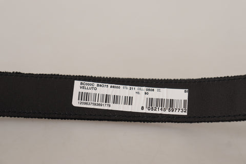 Black velvet Dolce & Gabbana belt with engraved metal logo, featuring a sleek design and classic logo detail.
