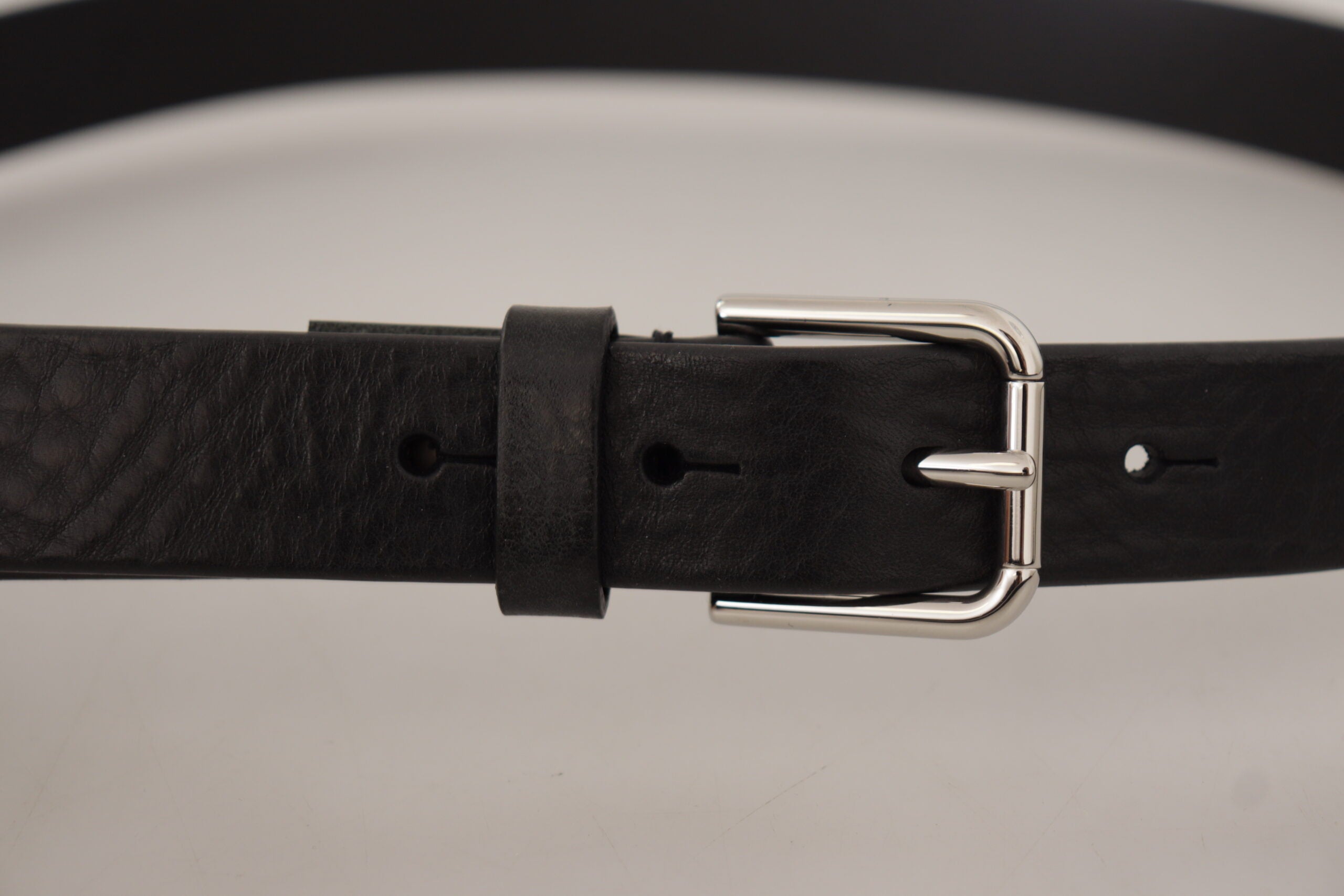 Black calf leather belt with silver tone logo metal buckle from Dolce & Gabbana.