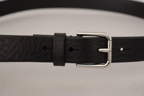 Black calf leather belt with silver tone logo metal buckle from Dolce & Gabbana.