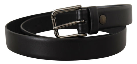 Black calf leather belt with classic logo metal buckle from Dolce & Gabbana, featuring smooth leather and silver-tone hardware.
