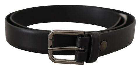 Black calf leather belt with a classic logo and metal buckle from Dolce & Gabbana, showing smooth leather and polished hardware.