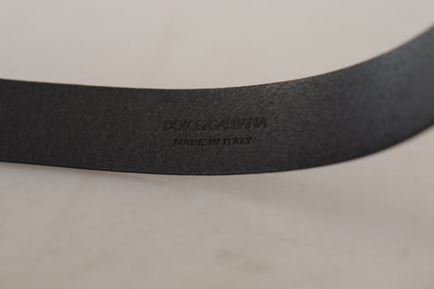 Black calf leather belt with classic logo and metal buckle from Dolce & Gabbana, featuring smooth leather and stylish design.