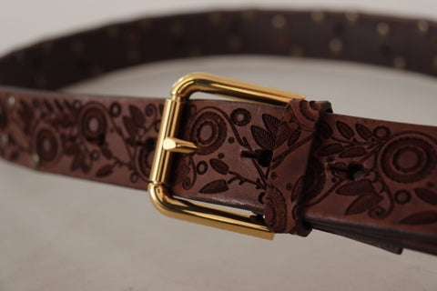 Brown calf leather belt with embossed pattern and gold metal buckle by Dolce & Gabbana.