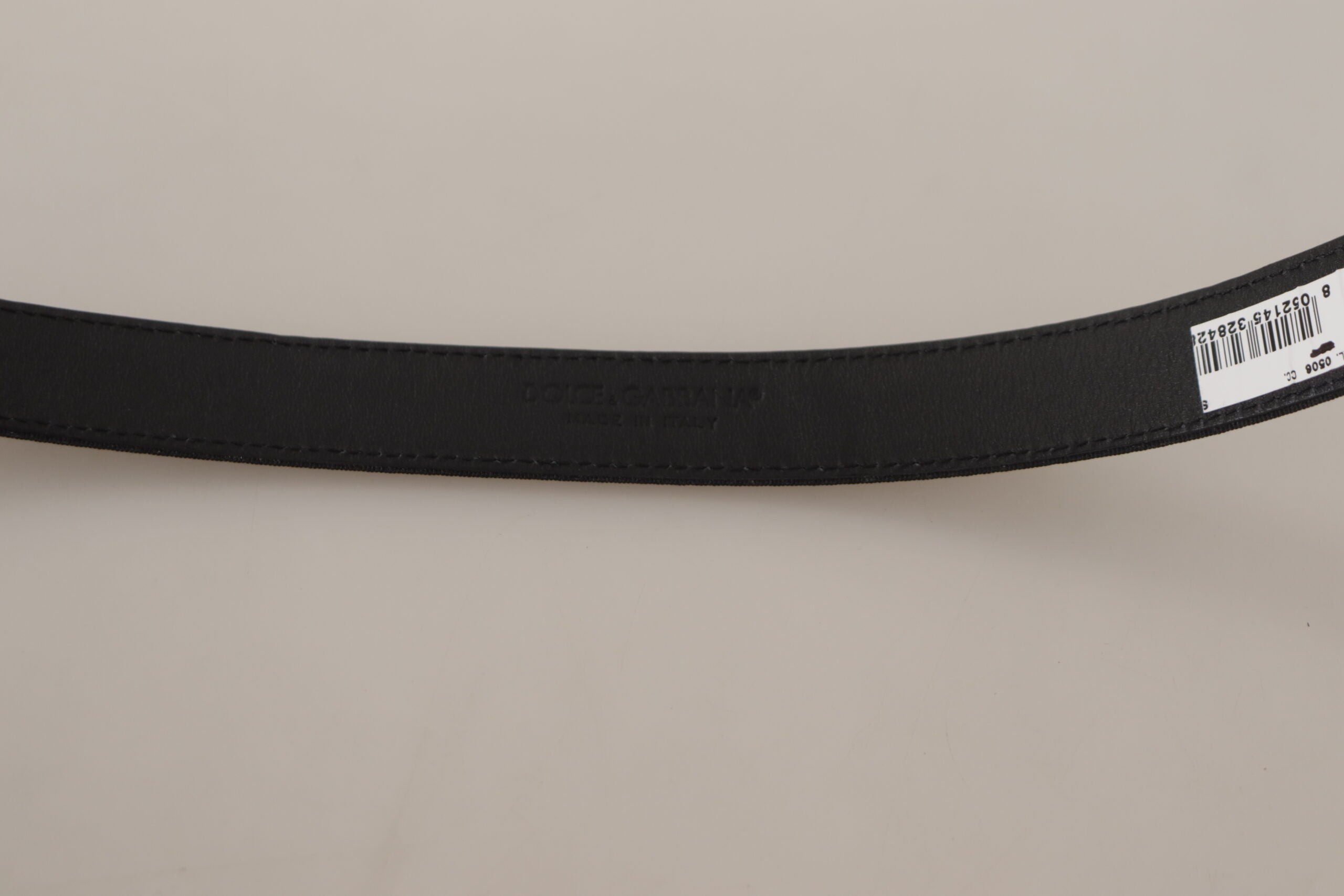 Black calf canvas belt by Dolce & Gabbana with silver tone logo metal buckle, stylish and versatile accessory.