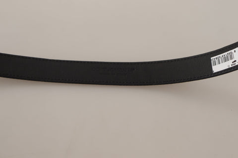 Black calf canvas belt by Dolce & Gabbana with silver tone logo metal buckle, stylish and versatile accessory.