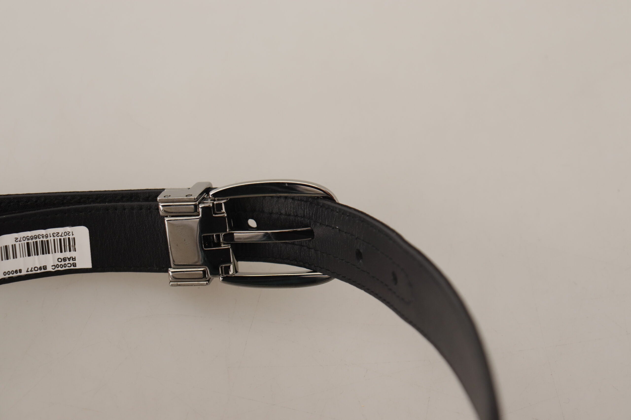 Black calf leather belt with silver logo metal buckle from Dolce & Gabbana, featuring a sleek and sophisticated design.