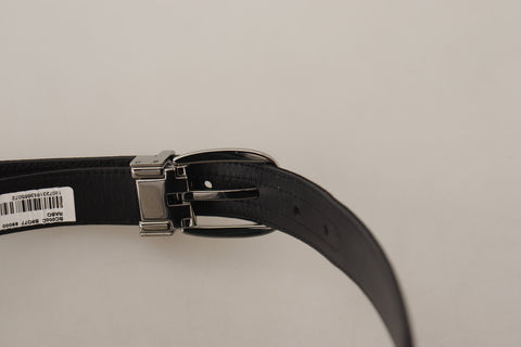 Black calf leather belt with silver logo metal buckle from Dolce & Gabbana, featuring a sleek and sophisticated design.