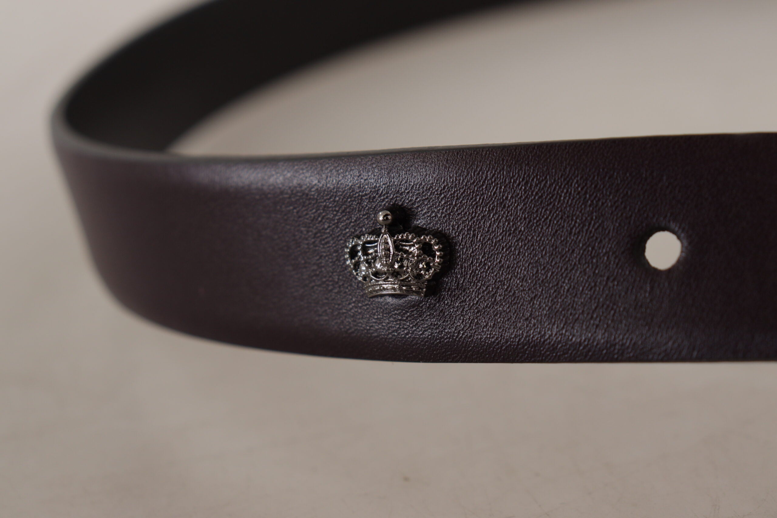 Dark purple leather belt with a Borchia metal buckle from Dolce & Gabbana, featuring a sleek and stylish design.
