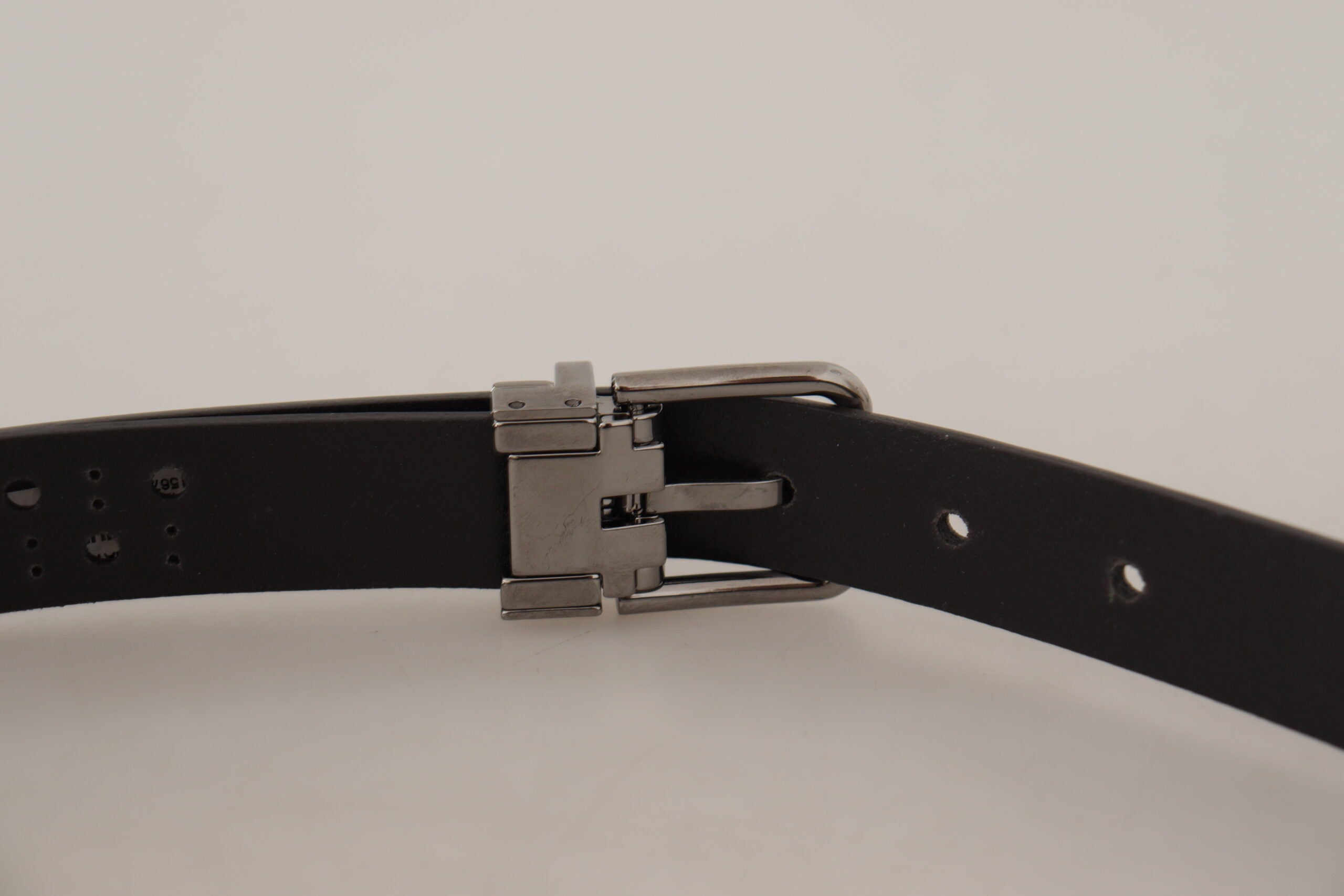 Dark purple perforated leather belt with metal buckle by Dolce & Gabbana, showcasing stylish perforated design and sleek hardware.