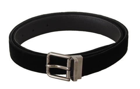 Black velvet belt with a metal buckle engraved with Dolce & Gabbana logo, featuring a classic design and elegant style.