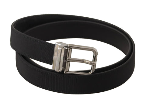 Black canvas and leather belt with silver metal buckle by Dolce & Gabbana, featuring a stylish and durable design.